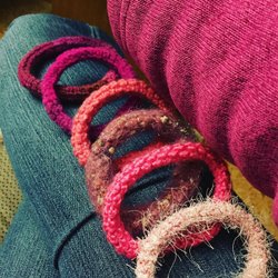 Photo by alicebyrnedesigns, caption reads: When your hands are busy your butt seats still. Great for those cold days. Commission bracelets for a Cancer survivor. Was so happy to do it even this busy time of year. She had bought one 2 years ago from me and misplaced it. And it meant so much to her. That is why I do it to bring joy and happiness into people's life's. #fernieartist mixed media can't just do one thing my head and hart are full of new ideas just by looking at materials. #creativeatheart #ferniestoke #orderanytime #cancersurvivor #giftsforher #cancer #positivevibes #fiberartist