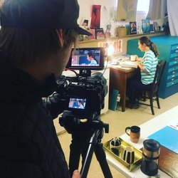 Photo by ferniemuseum, caption reads: If we are not working on one exhibition, it’s another. Preparing for our upcoming Hot and Cold: Glass Art In Three Parts exhibit featuring the work of one of Canada’s foremost glass artists, Katherine Russell from Elkford. We are doing something we have never attempted before: a video introduction, working with existing footage submitted by the artist and a bit of new footage we are shooting today with Nick Nault, to illustrate the three different processes she employs in her studio work. 
Exhibit opens December 13 as part of our upcoming Fire & Ice Holiday Gala.