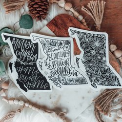 Photo by oliveandbrambleco, caption reads: Squad goals ✨~ two new black bc stickers on my website tomorrow, along with Kamloops + Kelowna 🖤’s, & “lucky we live in bc” minis
Also coming tomorrow ~sticker packs for the holidays!✨🙌🏻🎄✨⠀
⠀
⠀
#okanaganmade #okanaganvalley #yvr #vancouver #yvrlife #beautifulbritishcolumbia #vancouverbc #vancouvercanada #vancouvereats #nanaimo #britishcolumbia #explorevancouver #explorebc #explorecanada #vancouvervibes #hellobc #explorebcparks #canadianrockies #westcoast #westcoastbestcoast #vancouverisland #kitsilano #eastvan #northvancouver #hellobc #vancouverisbeautiful #nanaimobc #nanaimobusiness