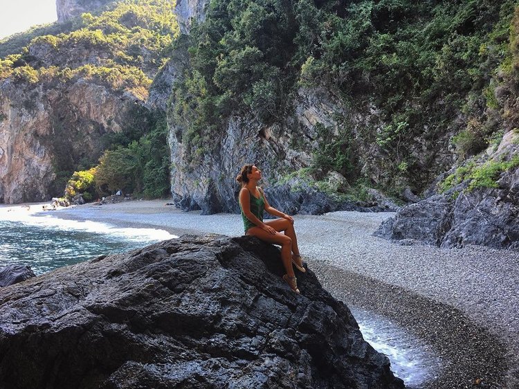 Photo by ptusia, caption reads: Place of unbearable beauty and indescribable power. My heart belongs there. #evvoia #xiliadou #urban_greece #vscogreece #greekislands #vintage_greece #amazingbeach #beautifulgreece #vscogr #vscoua #travelphotograpy #placeofpower #greekbeauty #visitgreece #colorsofgreece #tv_living #mountainbeach