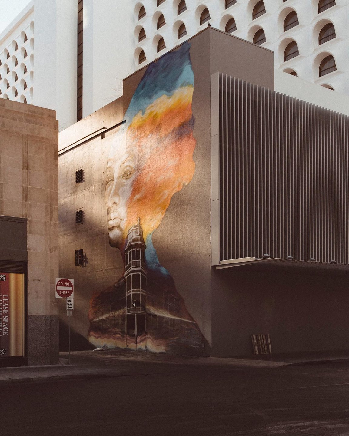 Photo by user phxforsure, caption reads Missing Melinda and downtown alleys. Going to have to take some photo walks this fall 😷🌆 mural by Hugo Medina #hugos_art and darrinarmijowardle
.
.
.
.
.
.
.
#arizonalove
#visualsofstreet
#myphx
#dtphx
#indiependentmag
#citygram
#igersphx
#thisaintartschool
#streetview
#streetshared