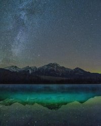 Photo by rockymountainscrambler, caption reads: The Auroral glow was low (see third pic 👉🏻 ), but it was still a blast to be under ALL of the stars in a Dark Sky Preserve such as Jasper NP on Saturday night!

1. I shone my light on the turquoise water of Patricia Lake to try to pick up some colour and the spooky mist that was hanging on the lake. 
2. Same shot, no light. 
3. The Green Goddess was low on the northern horizon, which I picked up with my wide angle lens. 

Any questions? Shoot away! 🌠 
——————————————————
Nikon D5500
Tokina f/2.4 10-20mm 
ISO 2400 | 15s 
——————————————————
#nightshooters #starrysky #jasperdarksky #darkskypreserve #longexposure #nightshots #milkyway #pyramidmountain #patricialake #explorejasper #myjasper #nightphotography