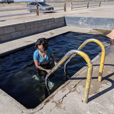 Sometimes the most #randomfinds are the best!  This is Fish Lake Valley Hot Well in the tiny town of Dyer, NV. The well that D is in is about 104 degrees. It was warm out but definitely not hot - a sunny 85 or so.  The hot spring ran into a cool pond. It felt wonderful to stand in the current where the hot and cool waters met. The ponds were home to koi, frogs, and a variety is water fowl. There were two little ponds in this oasis and they were magical. It was worth the five miles of washboard dirt road!

#rvwanderers #travel
#explore  #nvhotsprings #nevada #dyernevada #fulltimefamilies #fulltimwrvers #fishlakevalley #fishlakevalleyhotsprings #fishlakevalleyhotwell
